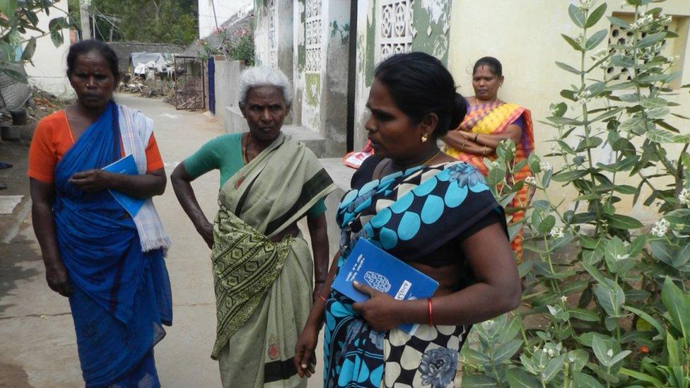 Rekha, nearest (holding book)