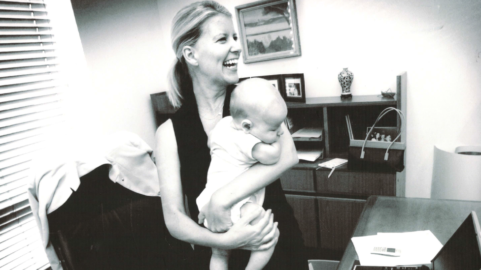 Natasha Stott Despoja holds her baby in her parliamentary office