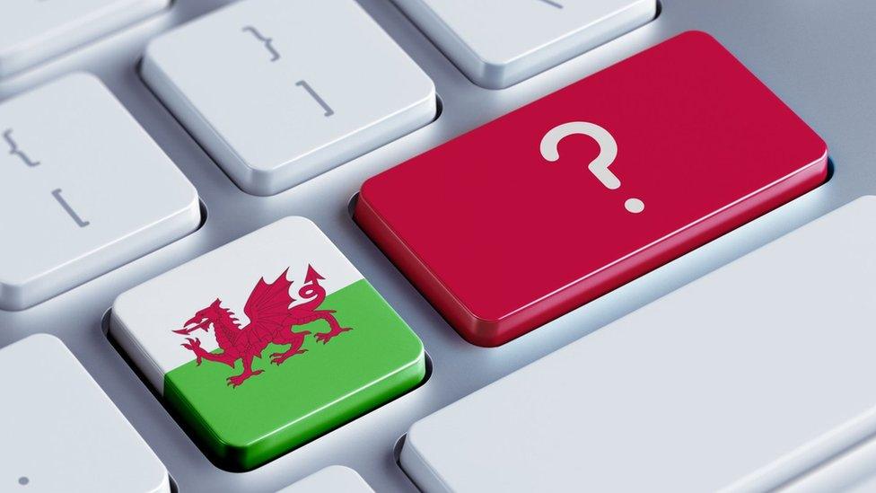 A welsh flag on a keyboard with a question mark