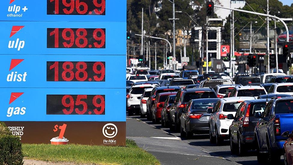 Cars queuing for petrol