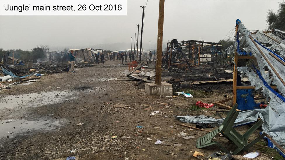 Main street in "Jungle" camp on 26 October shows shelters and shops flattened