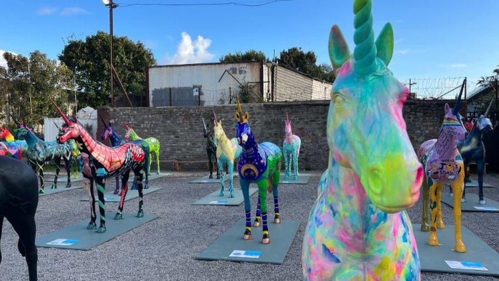 A group of unicorn sculptures