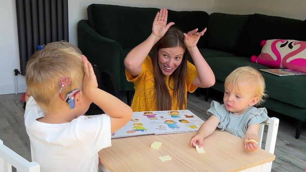 two children and a mum playing