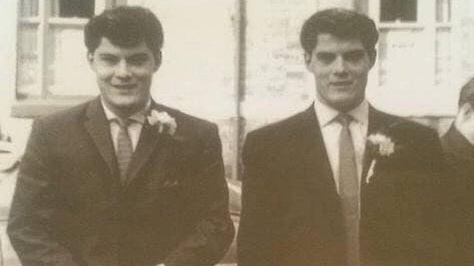 Old photo of two similar-looking men in wedding clothes