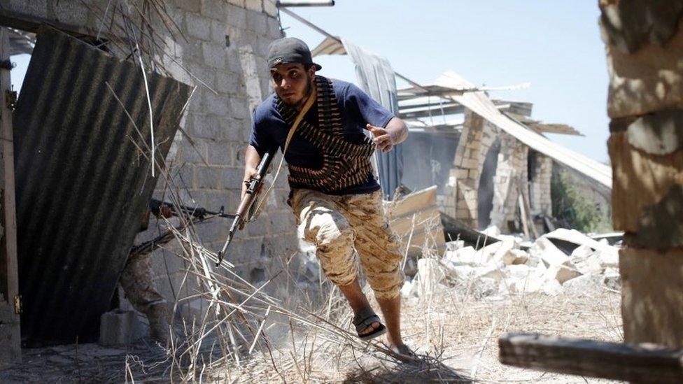 Libyan fighter allied to government during battle with IS in Sirte, July 2016