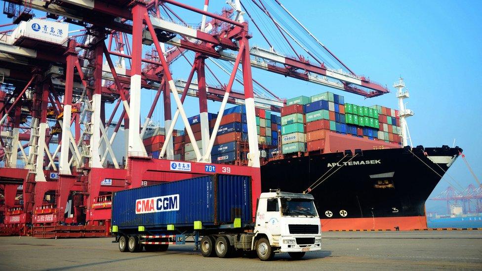 A loaded container ship is seen at a port in Qingdao, eastern China's Shandong province on July 13, 2017