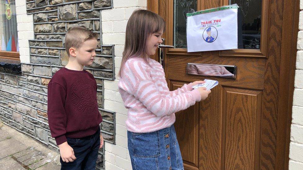 Children delivering the newsletter