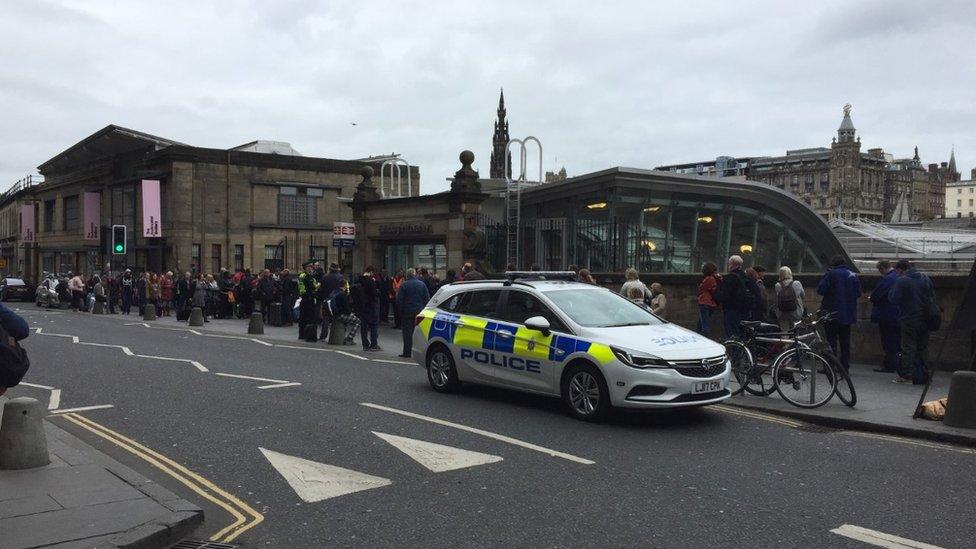 Passengers outside station