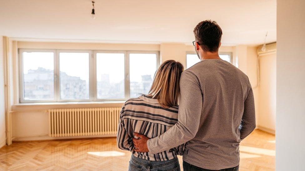 Couple looking at new home