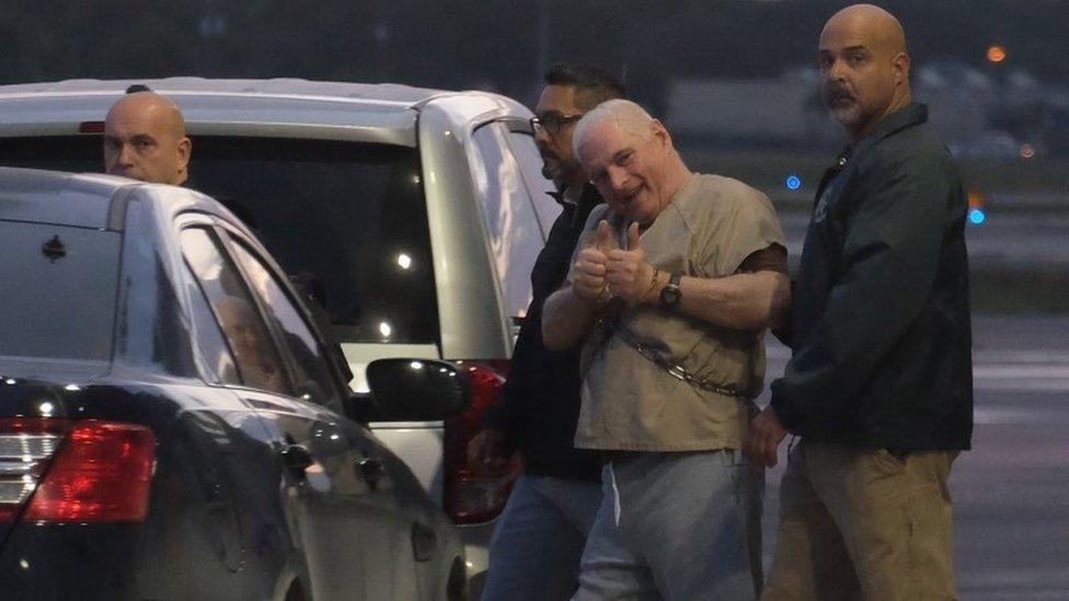 Former Panamanian President Ricardo Martinelli is escorted by US marshals to an awaiting jet early morning June 11, 2018 at Opa Locka airport near Miami