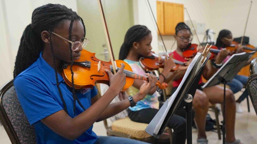 Emily James playing with the string section during a practice session ahead of October's show with the Royal Philharmonic Orchestra in London