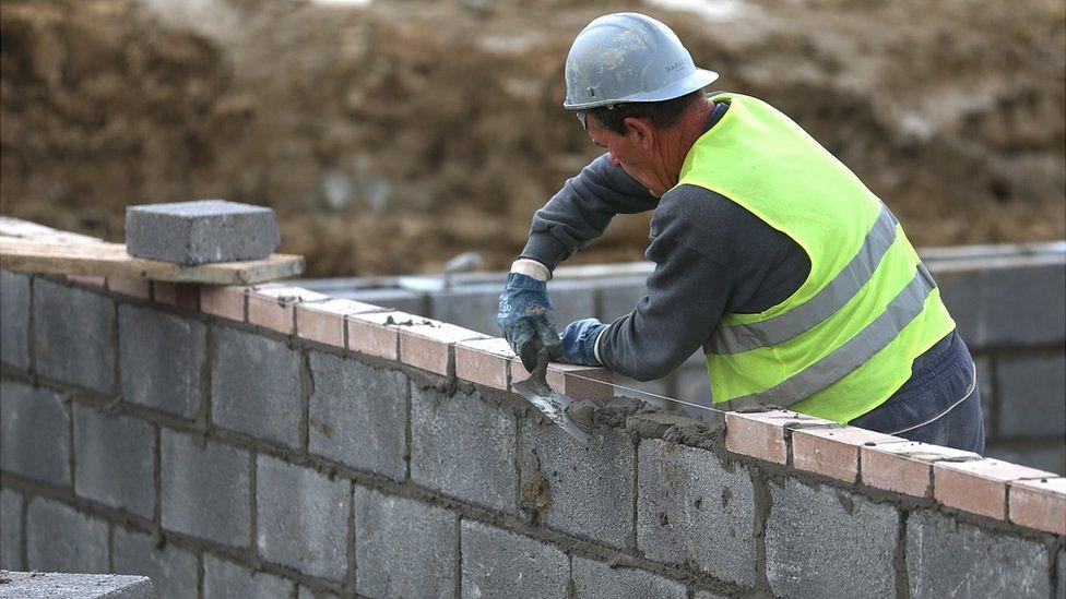 Construction worker building a house