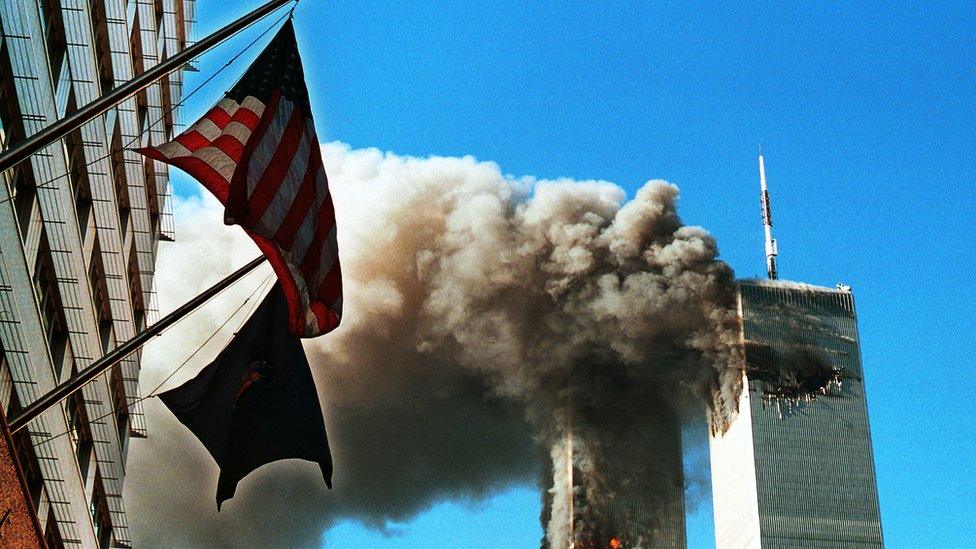 Smoke pours from the World Trade Center towers on 9/11