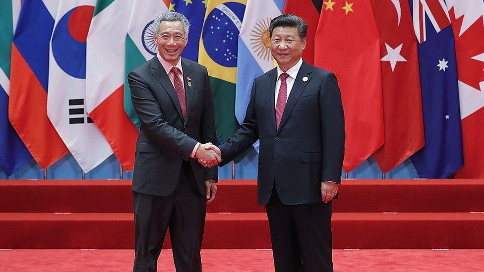 Chinese President Xi Jinping (right) shakes hands with Singapore's prime minster Lee Hsien Loong during the G20 Summit at the Hangzhou International Expo Center on September 4, 2016 in Hangzhou, China