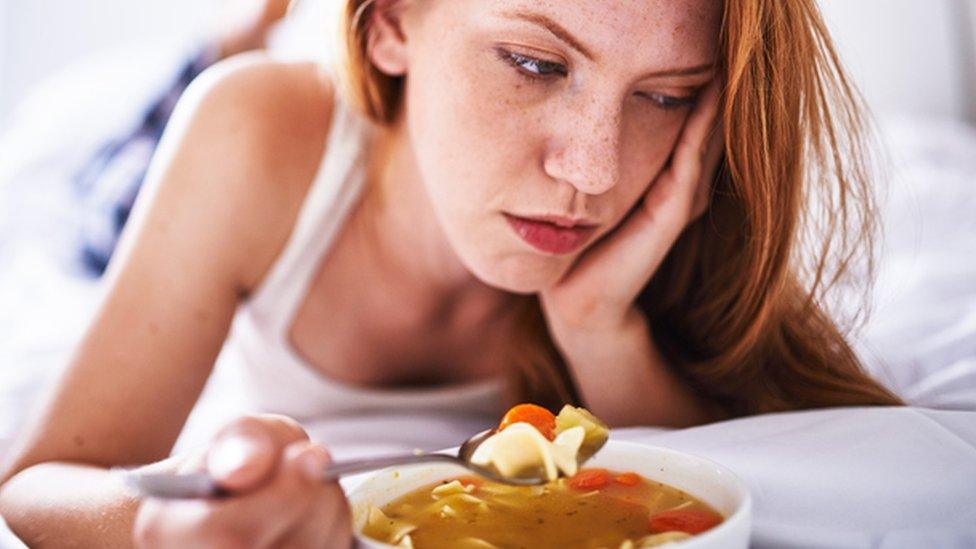 Girl eating soup