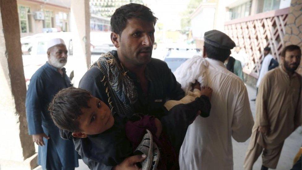 A young boy who was injured in a twin suicide bomb blasts, that targeted girl's schools, is rushed to a hospital to receive medical attention in Jalalabad, Afghanistan, 11 September 2018.