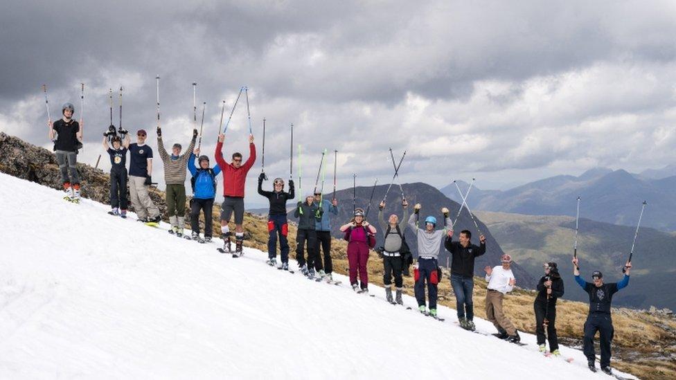 skiers-lifting-poles-in-the-air