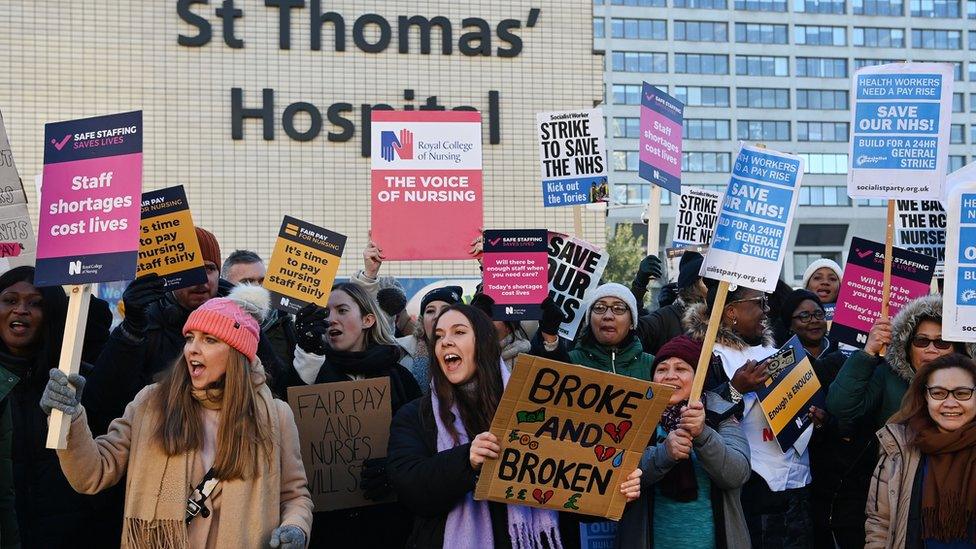 NHS nurses rally outside St.Thomas' Hospital in London.