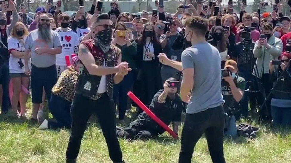 a game of rock, paper, scissors between organiser Josh Swain and another Josh Swain from Omaha