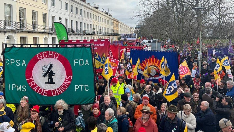 Thousands marching with banners