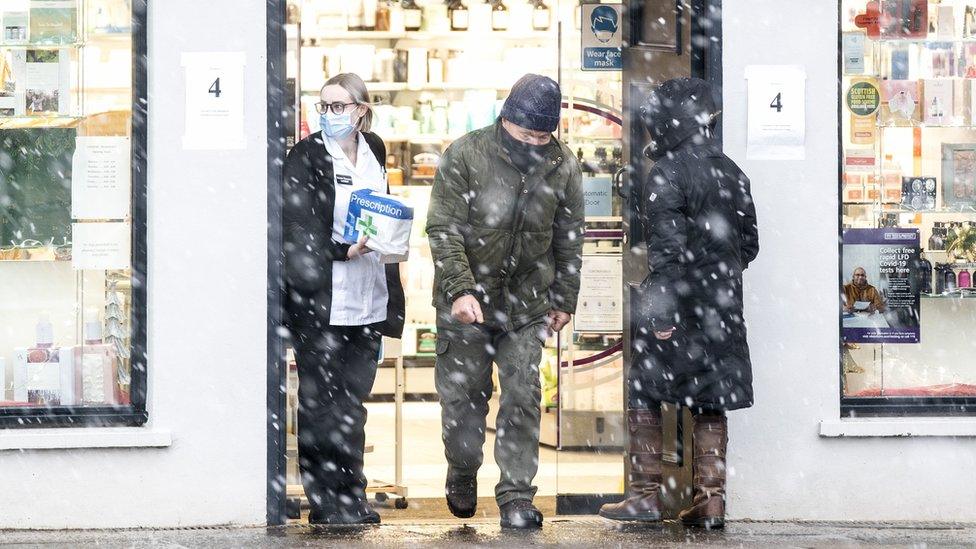 Sleet and snow fall outside Graeme Pharmacy in Biggar, South Lanarkshire as Storm Barra hits the UK and Ireland with disruptive winds, heavy rain and snow on Tuesday.