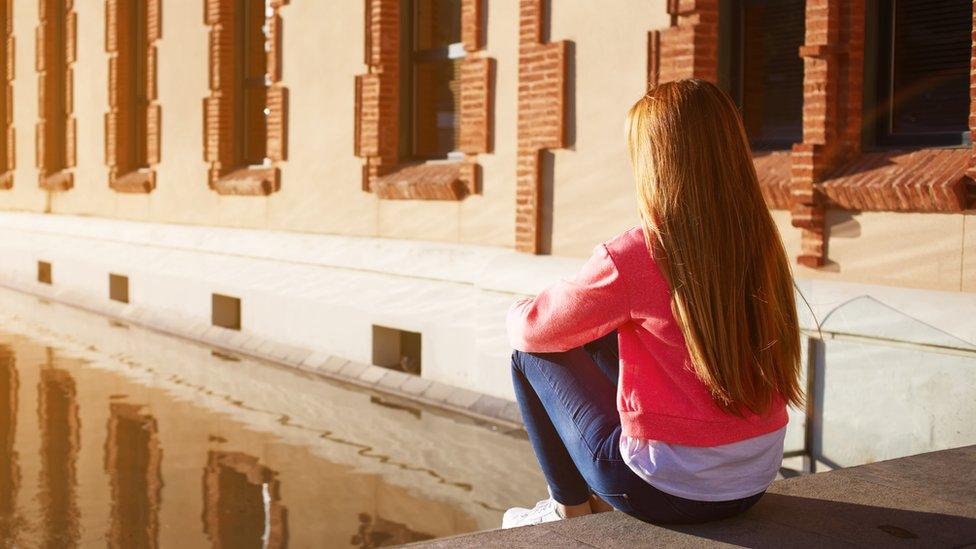 A young girl thinking