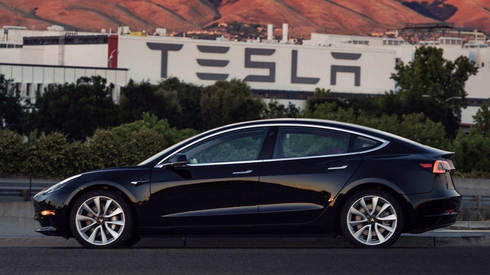 A Tesla Model 3 outside the company's factory in California