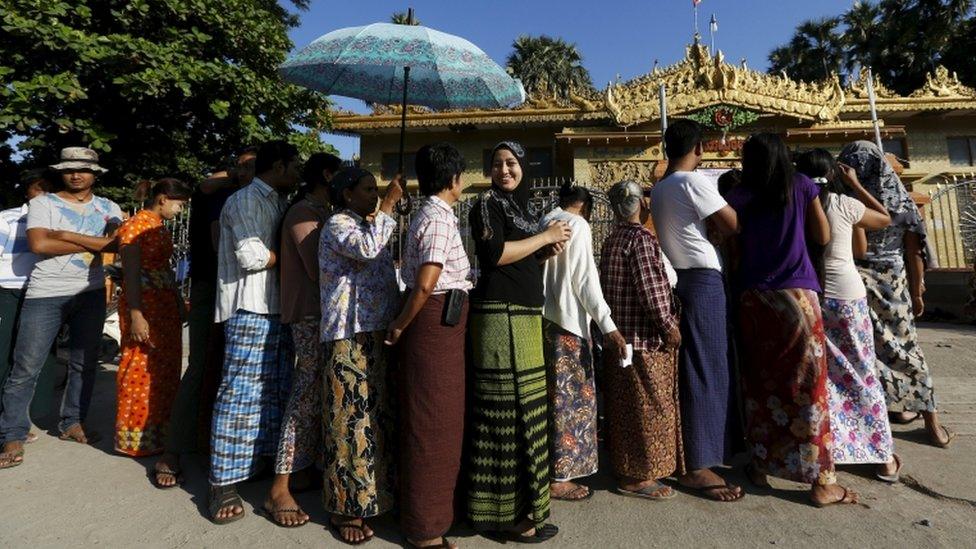 Voters queue at a polling station in a Buddhist prayer hall in Mandalay