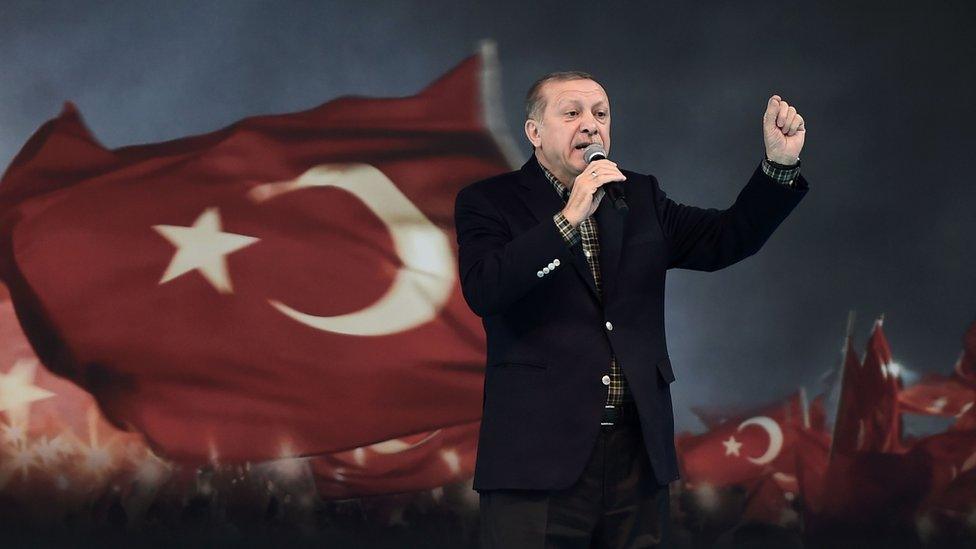 Turkish President Recep Tayyip Erdogan gestures as he delivers a speech on stage on March 5, 2017 in Istanbul