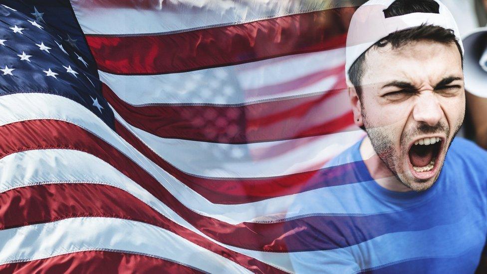 Man shouting in front of an American flag