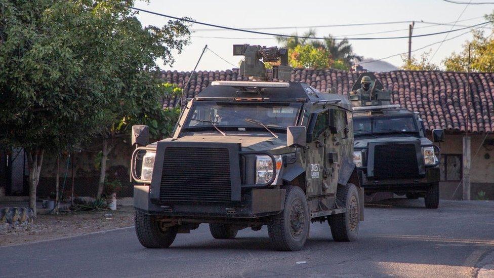 Mexican Army vehicles patrol the streets in Aguililla, Michoacán state, Mexico, on 9 February.