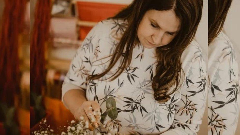 Tammy Weaver arranging flowers for a wedding