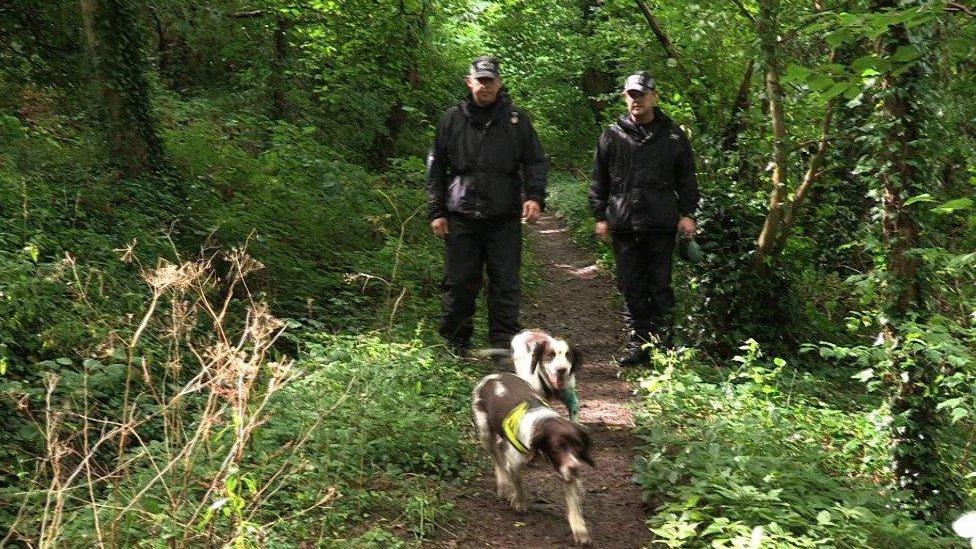 Police searching with dogs