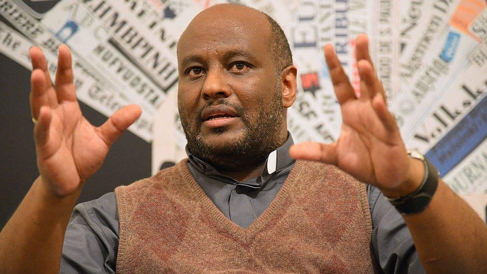 Eritrean priest Mose Zarai who funded the humanitarian association Habeshia, speaks to the press on October 31, 2013 in Rome