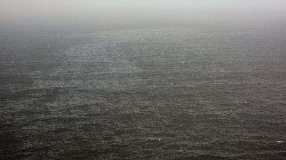 A handout picture of a section of oil slick in the Atlantic Ocean