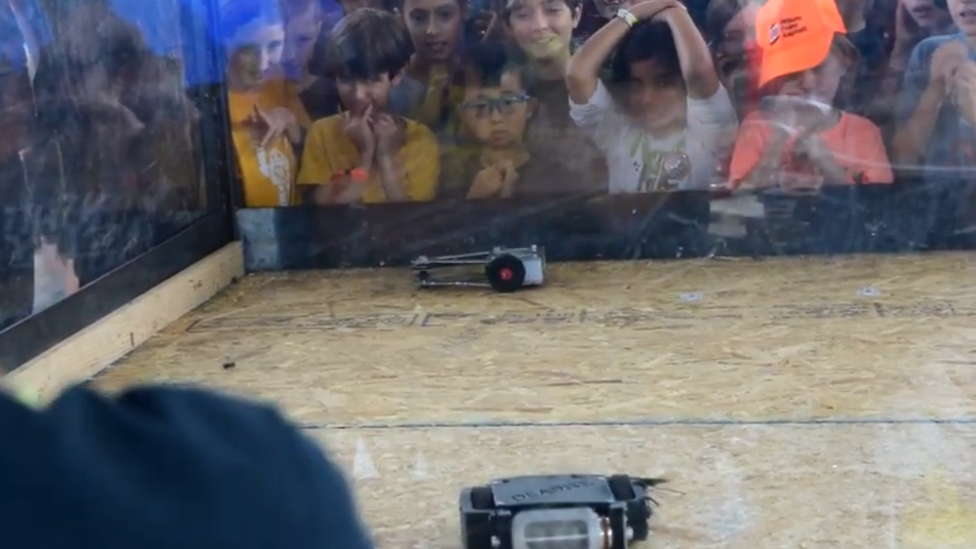 children watch robot war