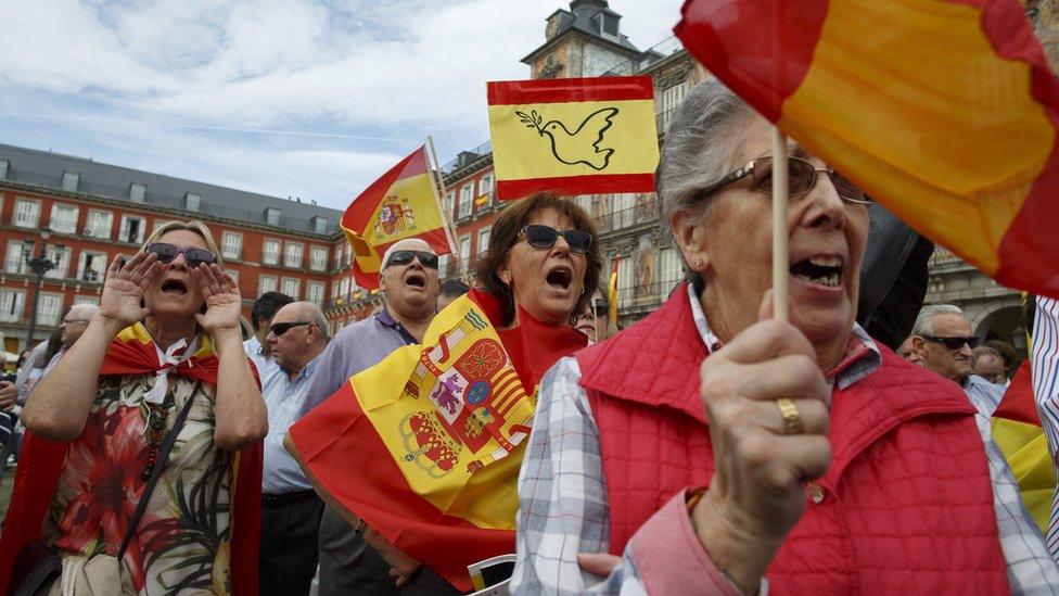 Anti-separatist demonstrators hold Spanish flags and shout slogans during a protest in support of Spain"s unity in Madrid - 1 October 2017