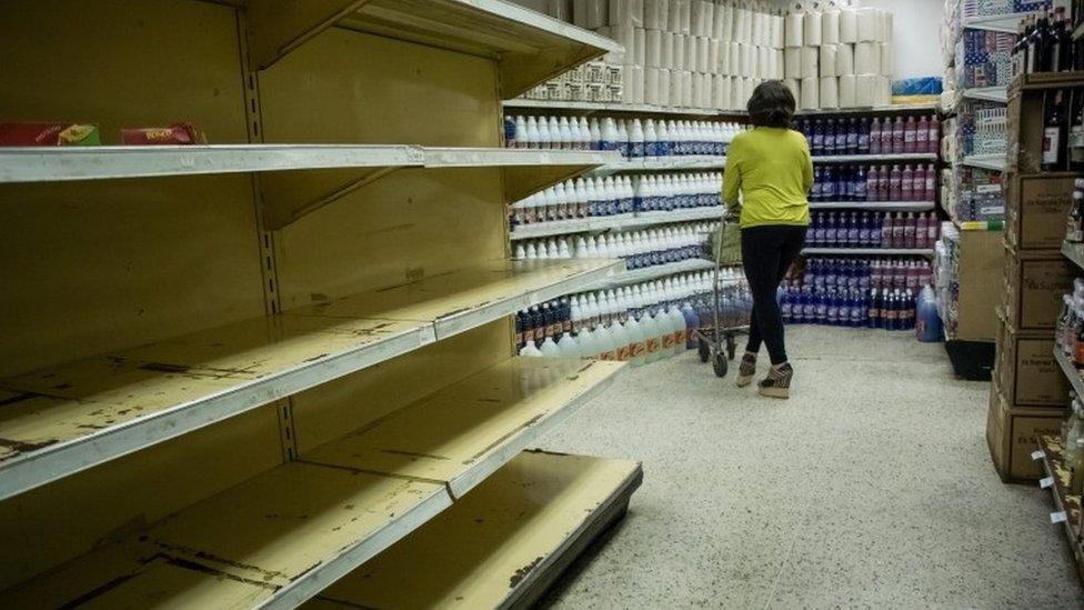 Empty shelves in Caracas supermarket