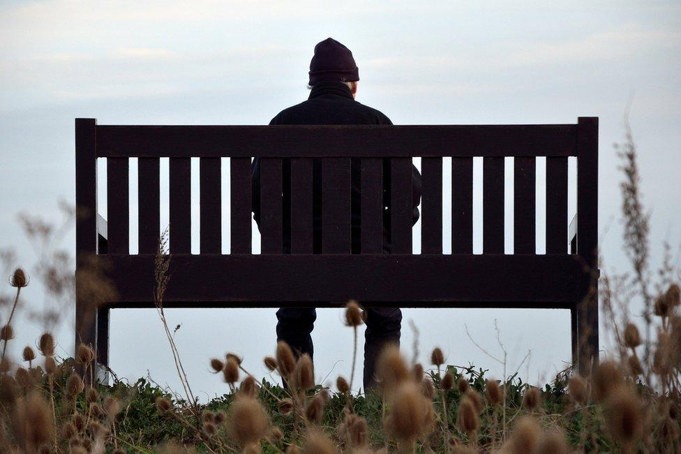 Old man sitting on bench