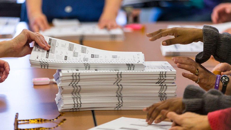 Tabulators work on recounting presidential ballots in Madison, Wisconsin.