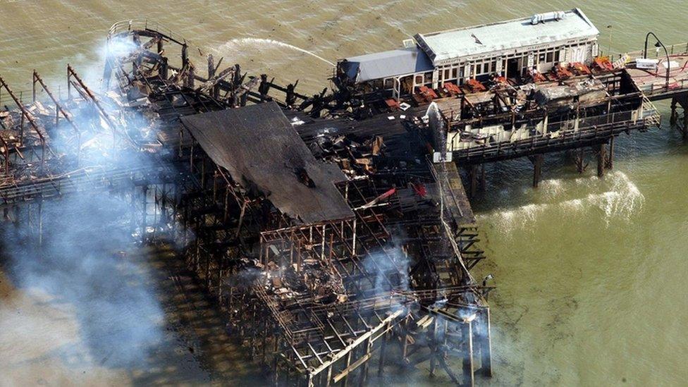 Aerial photo showing smouldering buildings on Southend Pier