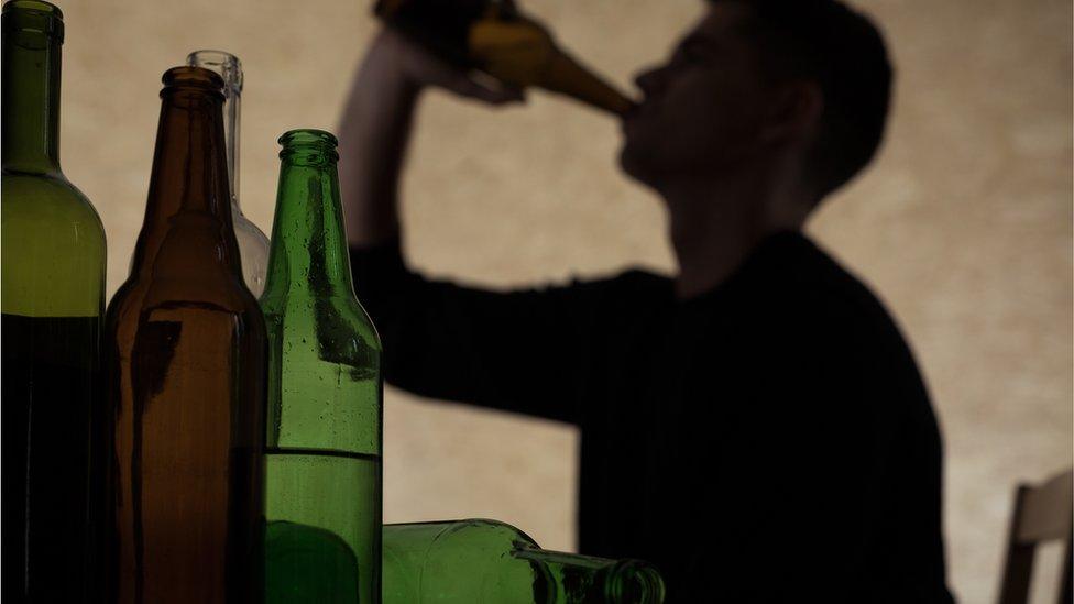 man drinking beer