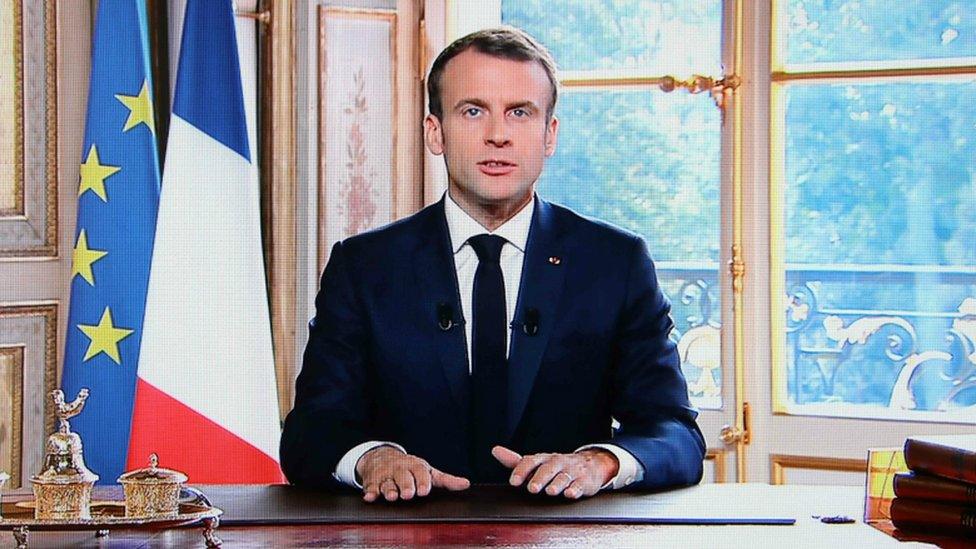 A TV screen displays French President Emmanuel Macron delivering a speech after the results of an independence referendum in the French Pacific territory of New Caledonia. 4 Nov 2018