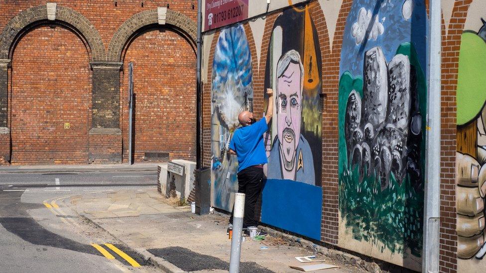 Steve Light painting his mural