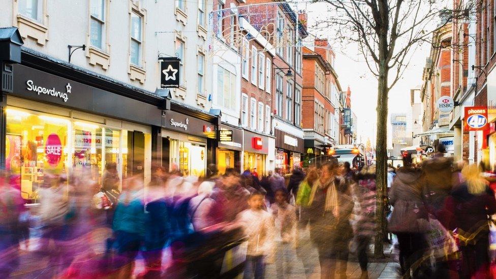 A high street with shoppers