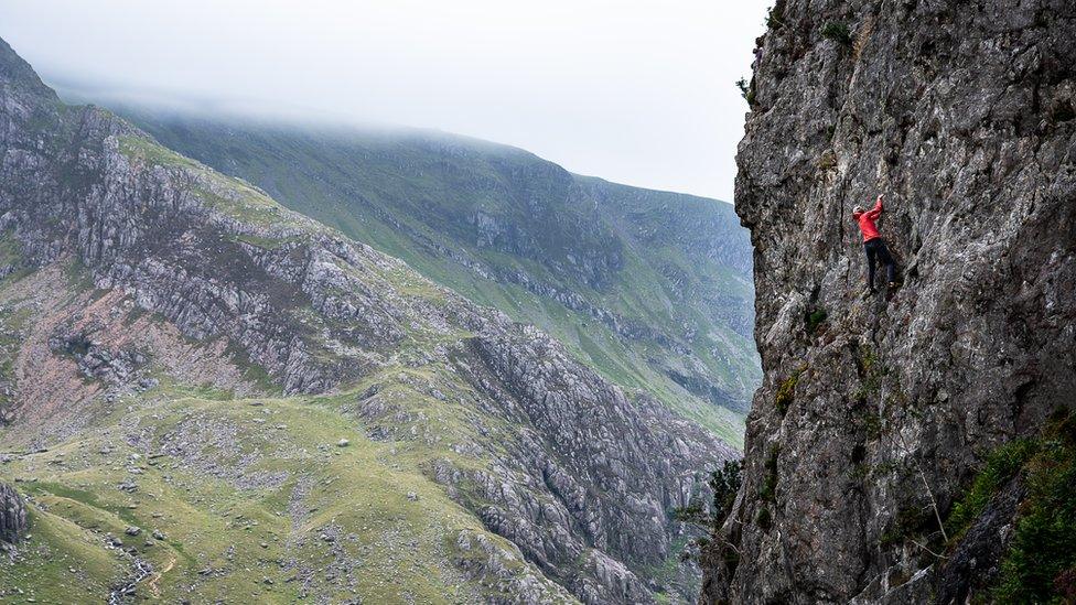 Anna Taylor climbs a route solo in Wales