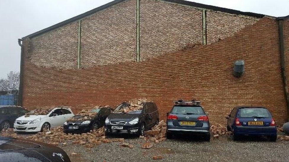 A wall next to a car park on Cleveland Street in Birkenhead, Wirral has collapsed onto several cars.