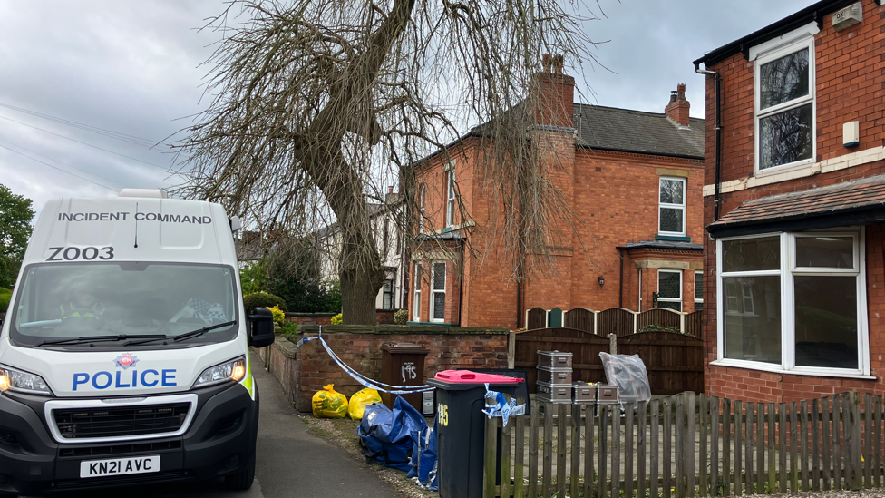 A police van outside a house in Worsley Road, Salford