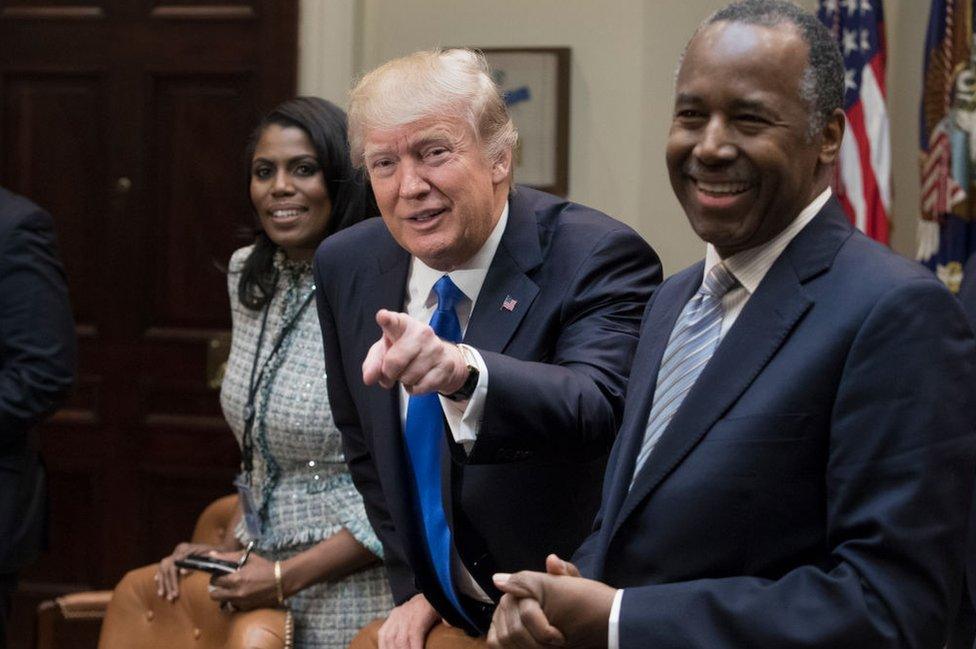 Mr Trump with Mrs Manigault and Housing Secretary Ben Carson