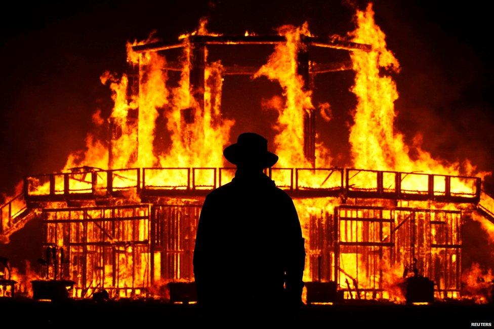 A Burning Man Ranger guards the inner perimeter around the effigy of The Man